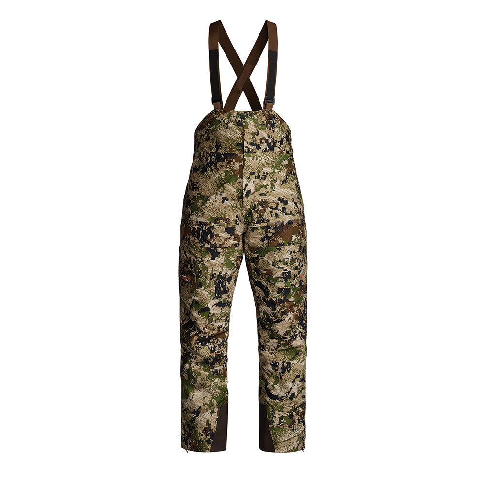 Camouflage bib overalls with dark brown suspenders, shown against a plain white background.